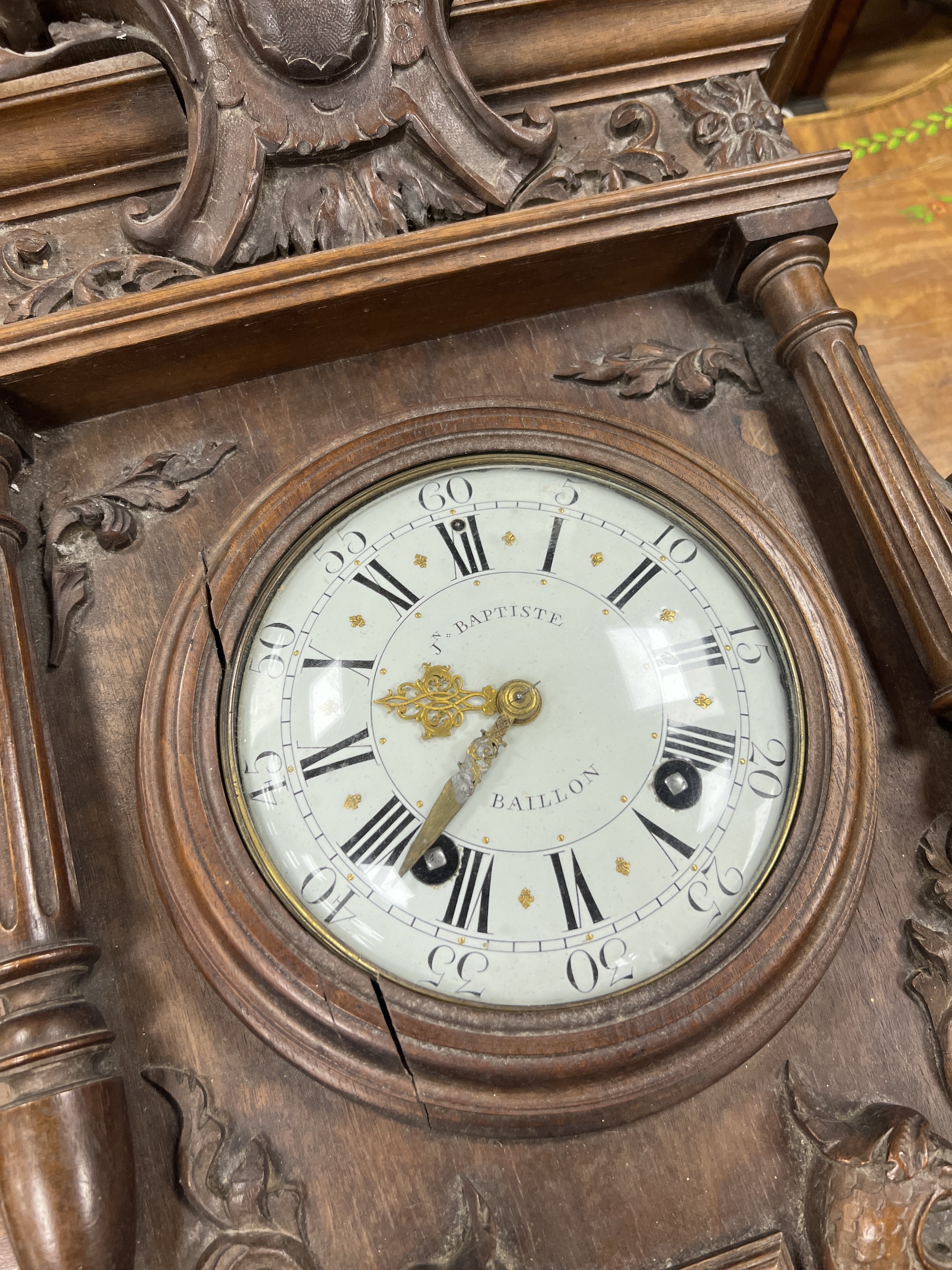 A late 19th century French carved walnut wall clock combined thermometer and barometer, dial and movement marked J Baptiste Baillon, Paris, height 93cm